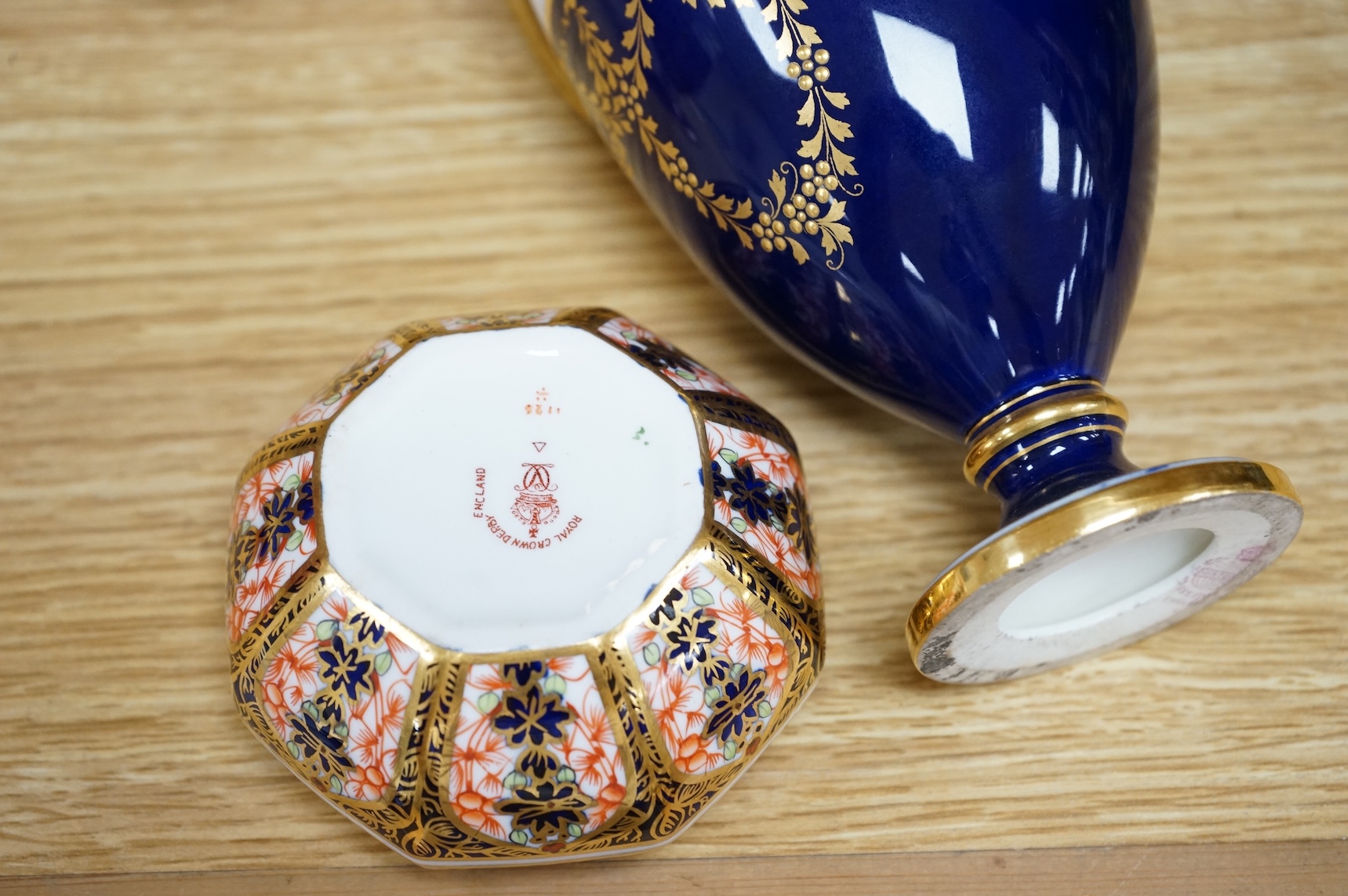 A Royal Crown Derby Imari miniature bowl and similar ewer, together with two Minton two handled vases, one with a cover, 18cm